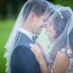 Wedding couple with veil