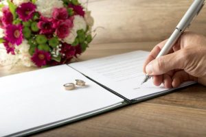 Signing wedding paperwork